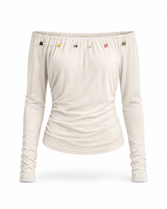 Ivory off shoulder ruched long sleeve top with colorful bead details