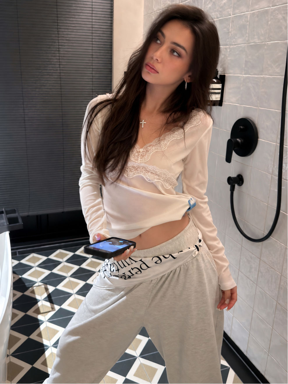 Ivory lace trim V-neck top shown from the front