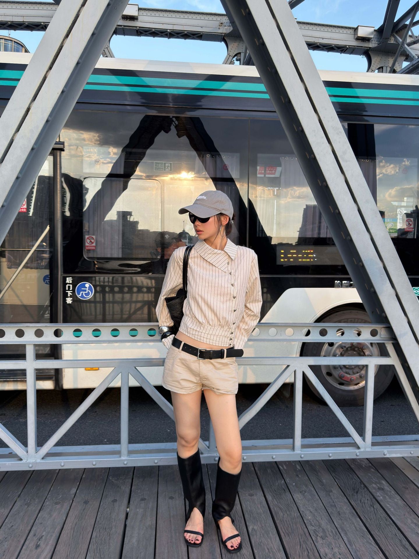 Women's cropped striped cotton blouse styled with casual city streetwear