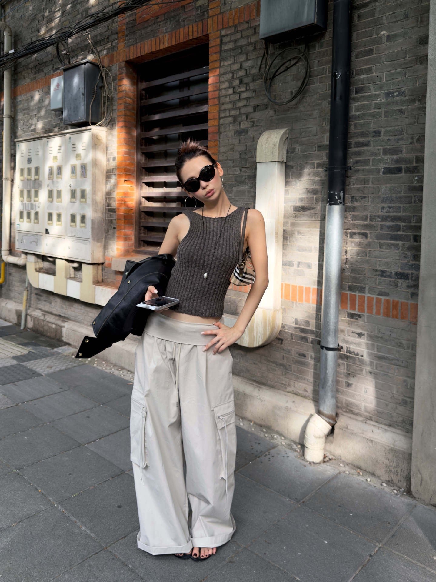 Vintage Foldover Waist Wide Leg Cargo Pants in Stone Mist styled with a black leather jacket and ribbed knit top for an effortless urban look.