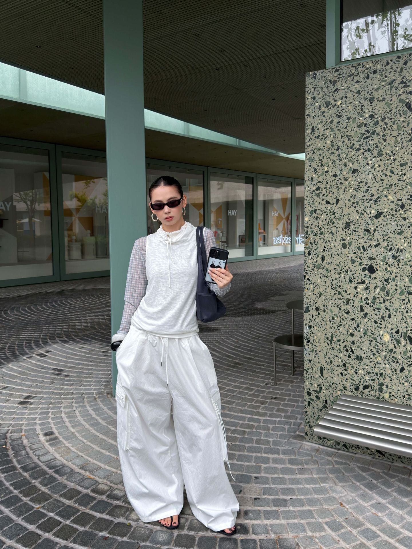 Vintage Foldover Waist Wide Leg Cargo Pants in Cloud White styled with a layered top and shoulder bag for a relaxed contemporary outfit.