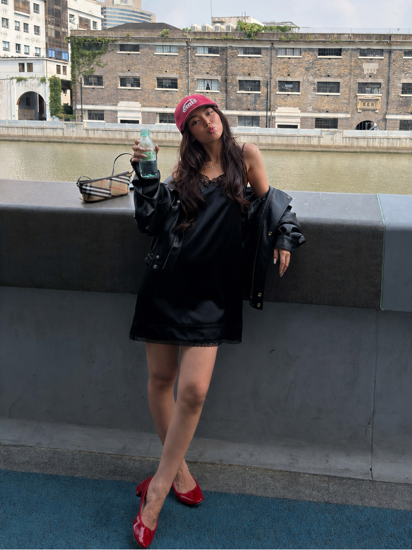 Midnight Noir satin lace slip mini dress styled with an oversized black leather jacket and red flats