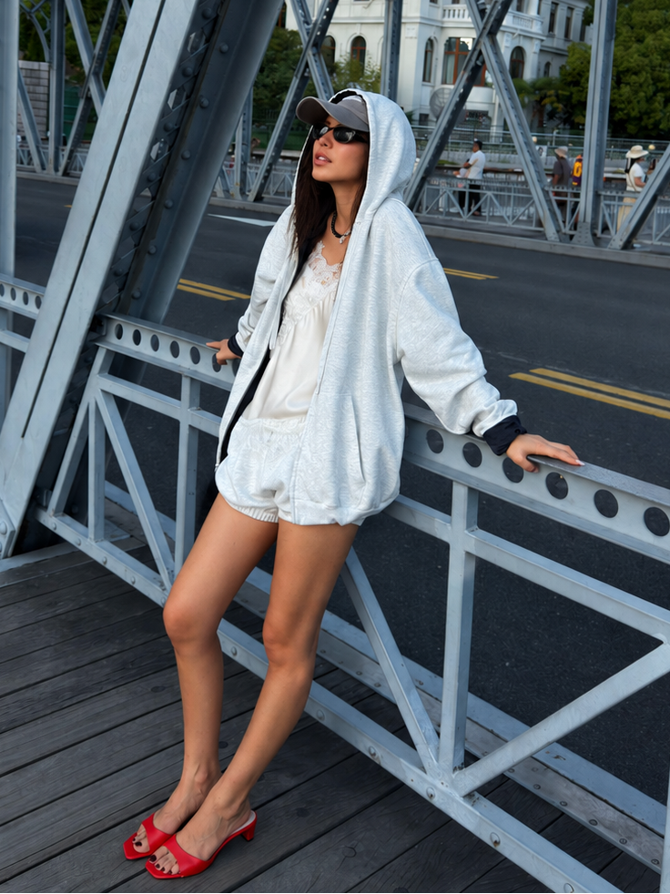Front view of the Florise Studio Reversible Oversized Zip Hoodie Jacket in Heather Cloud, featuring a relaxed oversized fit, adjustable hood, front zip closure, and reversible double-sided design.