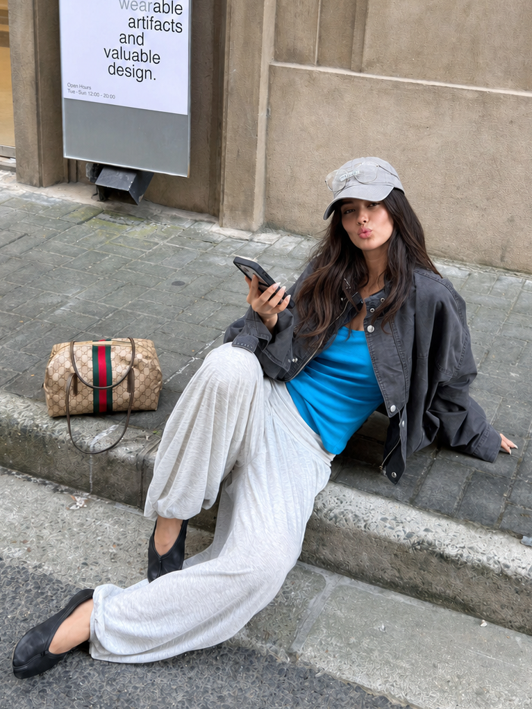 Woman wearing the Florise Studio Oversized Vintage Utility Stand Collar Jacket in Washed Charcoal featuring a relaxed oversized silhouette, asymmetric stand collar, and vintage-inspired utility design.