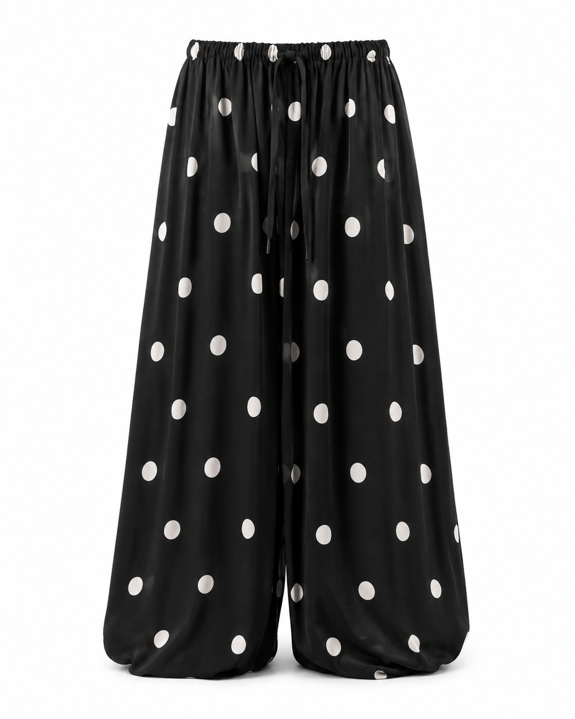 Black polka dot balloon pants with elastic waist and relaxed wide leg fit