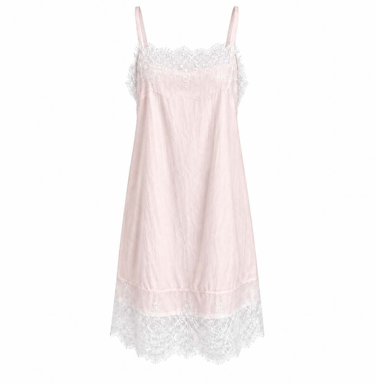 Front view of the Celeste Lace Layering Slip Dress in Blush Pink featuring adjustable spaghetti straps, floral lace trim and lightweight textured fabric.