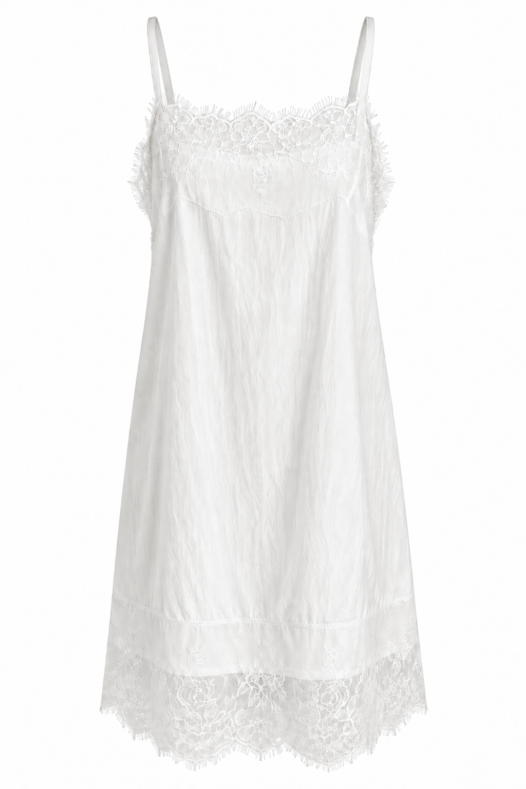 Front view of the Celeste Lace Layering Slip Dress in Pure White with floral lace neckline, delicate lace hem and a relaxed straight silhouette.