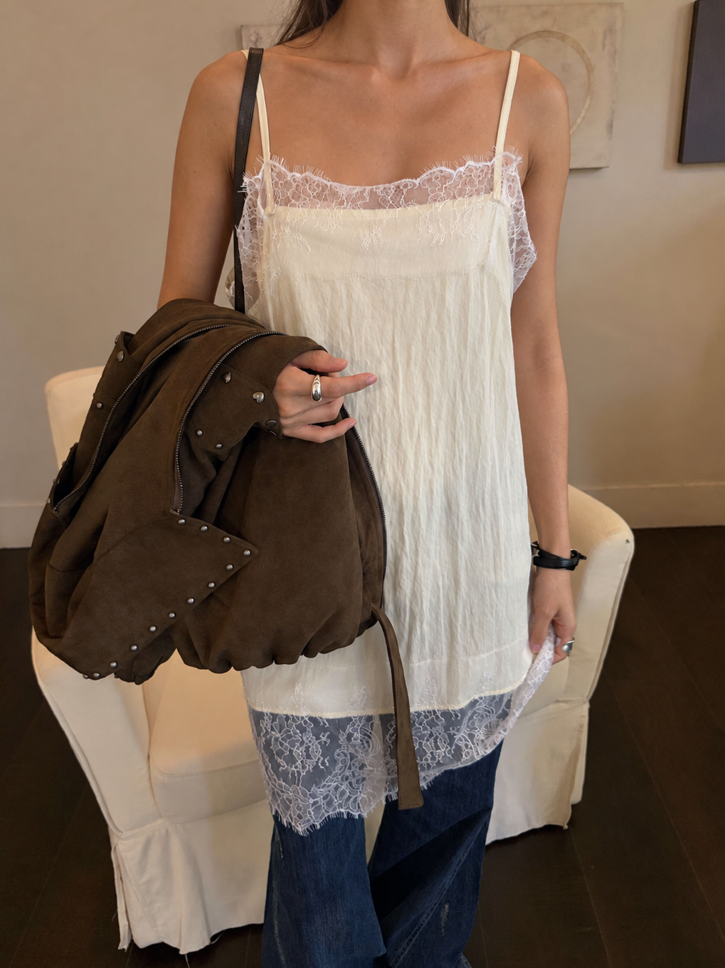 The Celeste Lace Layering Slip Dress in Soft Butter showcasing delicate floral lace trim, a relaxed straight silhouette and airy textured fabric.