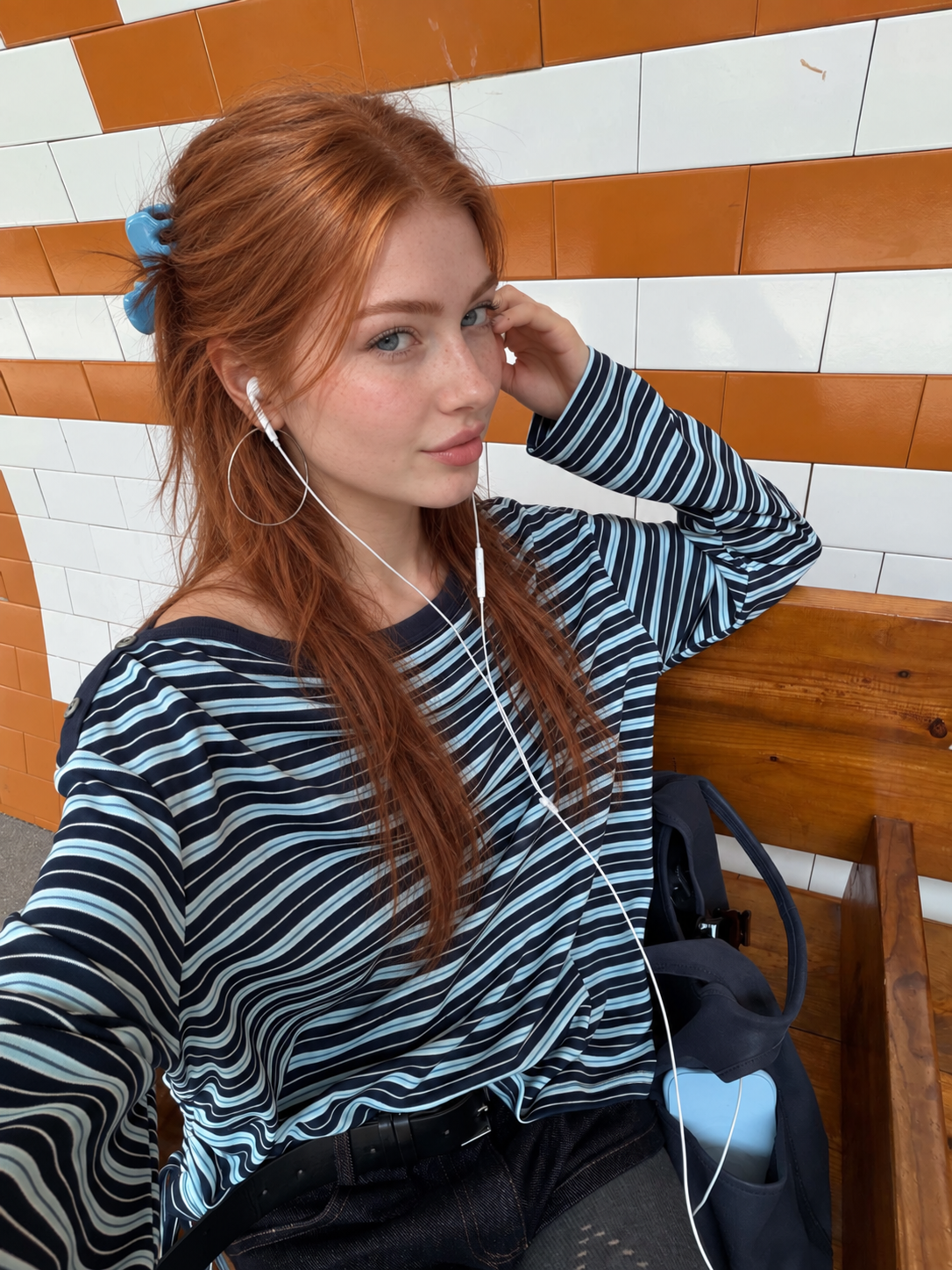Model wearing Florise Studio Sky Mist asymmetrical striped drawstring top with an off shoulder design and soft stretch fabric.