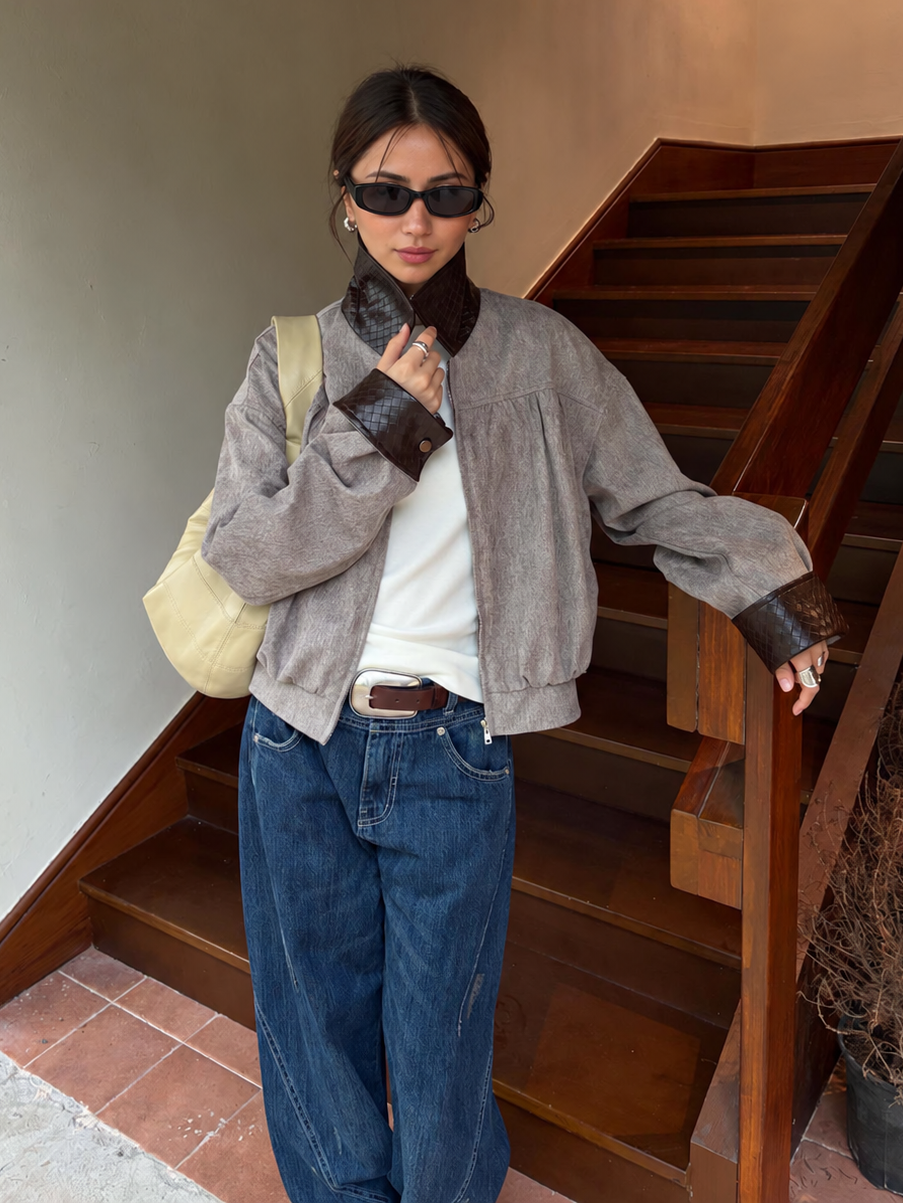 Contrast Collar Relaxed Zip-Up Jacket in taupe with brown trim – front view beside stairs