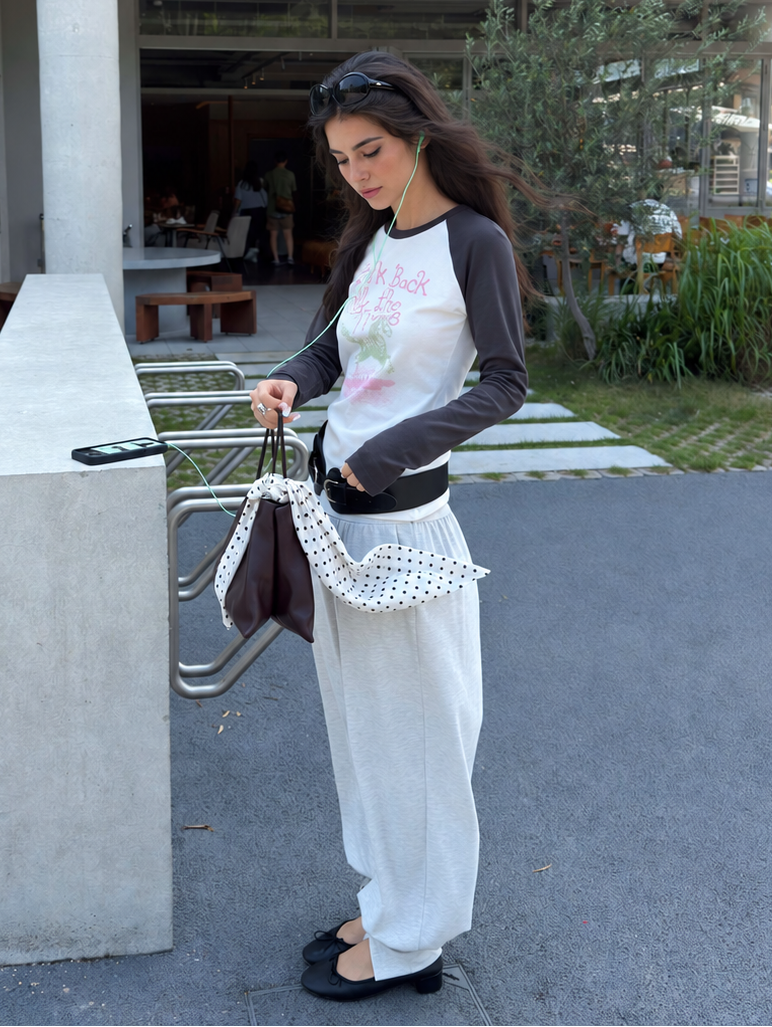 Look Back graphic raglan top in white and charcoal – full-length styling