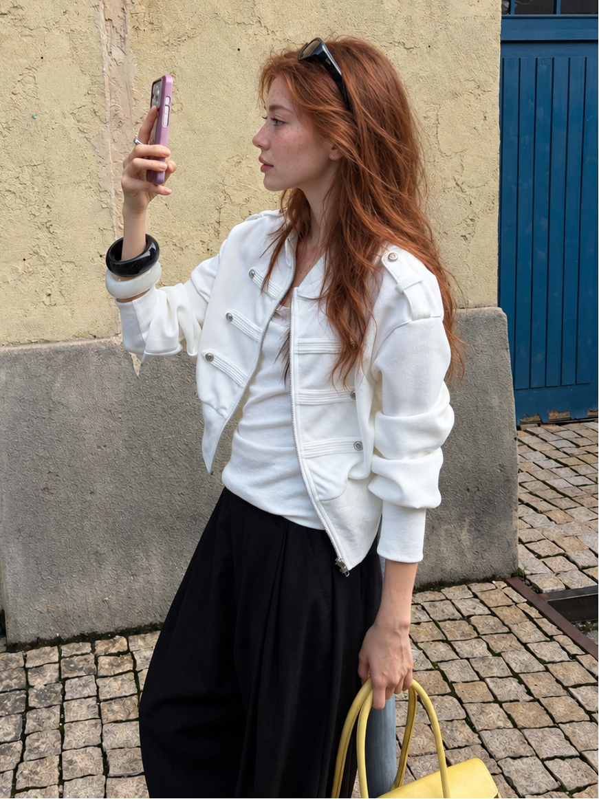 Model wearing the Florise Studio Military Cropped Jacket in Ivory White featuring a structured silhouette, stand collar, and modern military-inspired design.