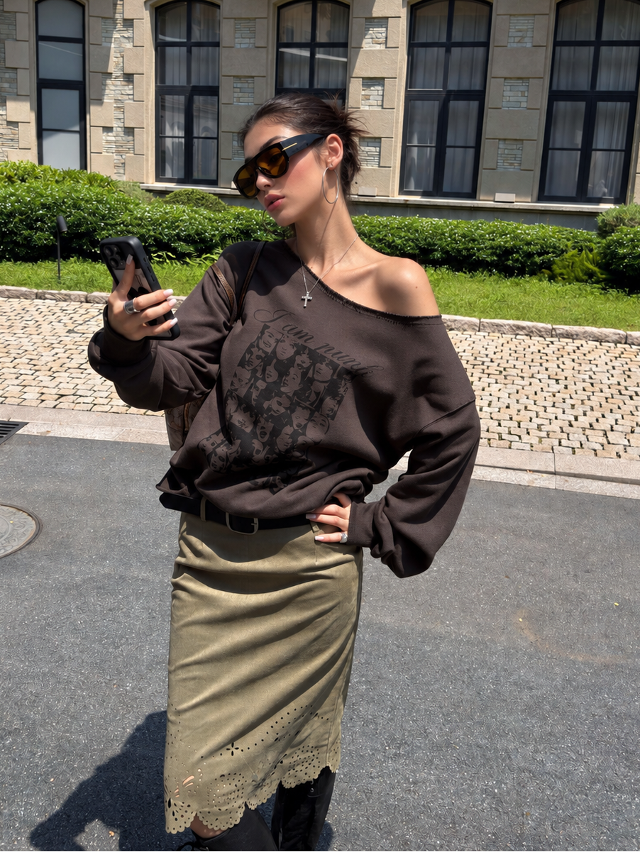 Off-Shoulder Cotton Graphic Top in dark brown – front styling with an olive skirt