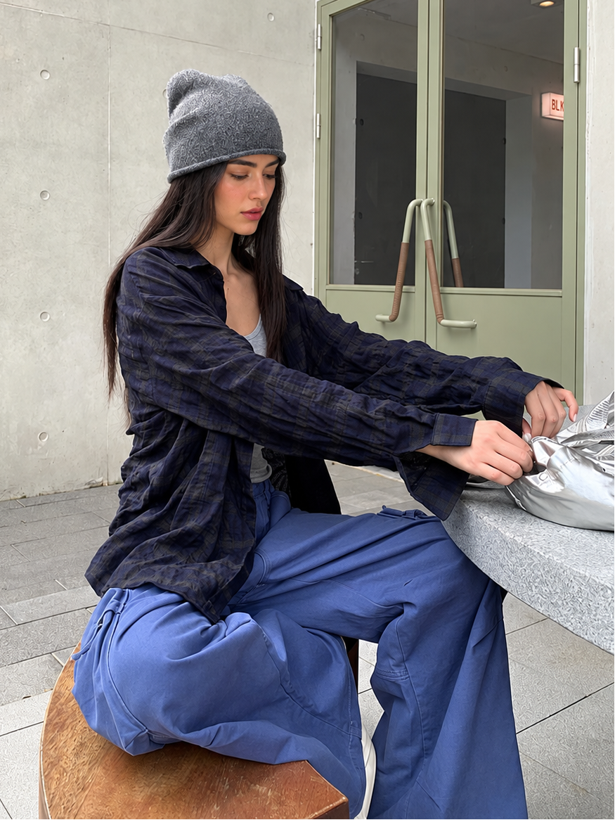 Oversized Textured Plaid Long Sleeve Shirt in Navy Plaid — side seated view