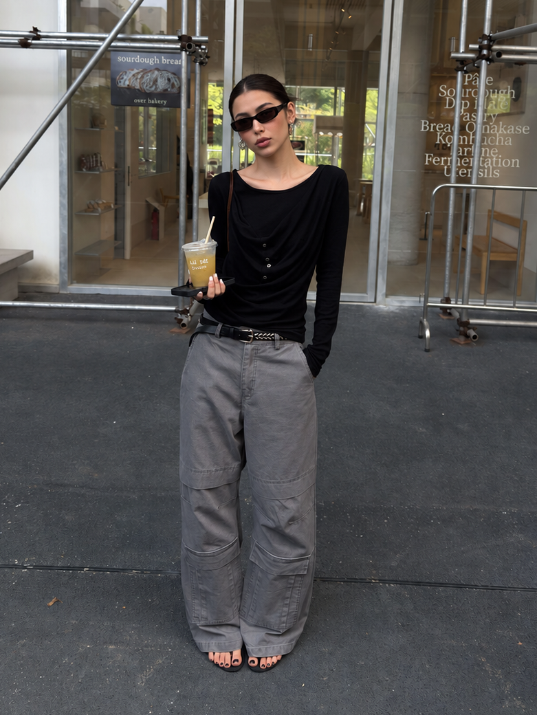 Side styling view of washed gray cargo pants