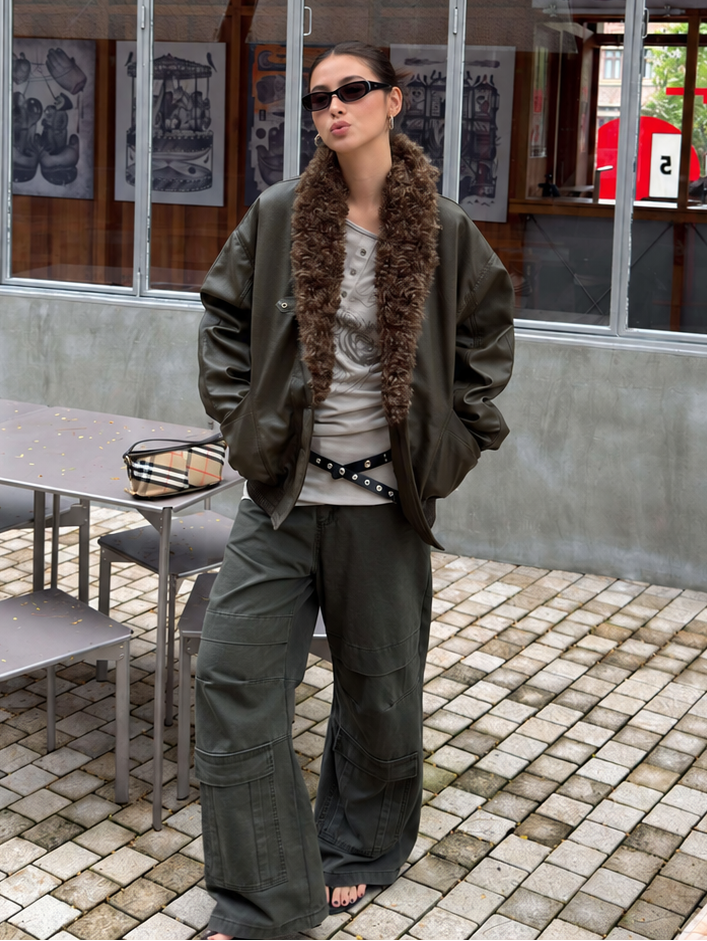 Cargo pocket detail of washed olive pants