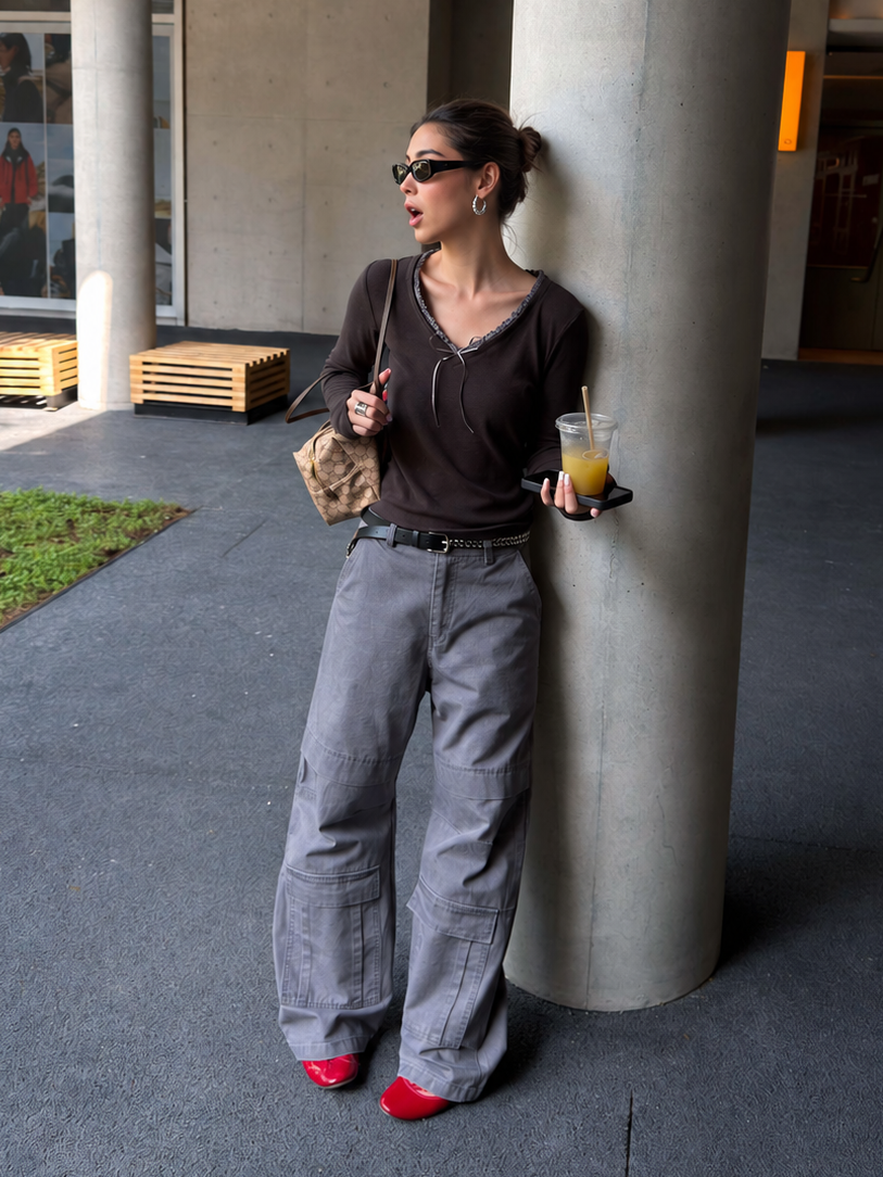 Side styling view of washed olive cargo pants