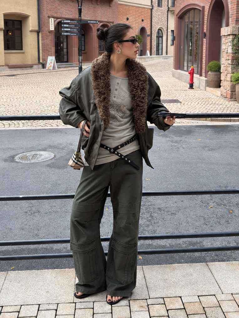 Full-length street styling view of washed olive cargo pants