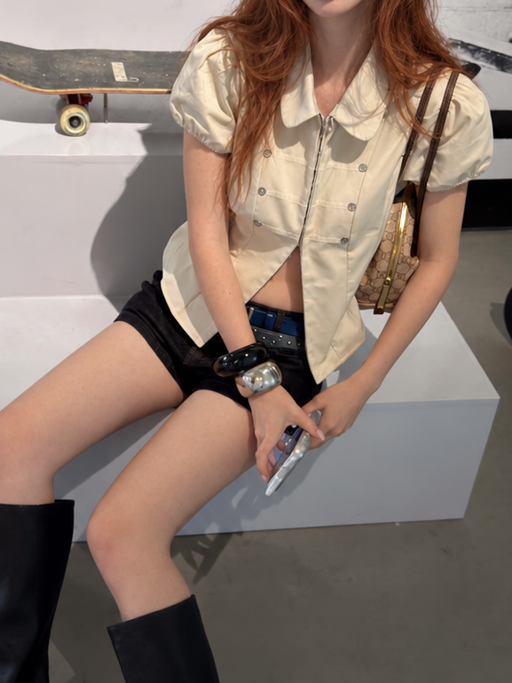 Ivory Cream Vintage Military Puff Sleeve Shirt worn with denim shorts for an effortless everyday outfit.